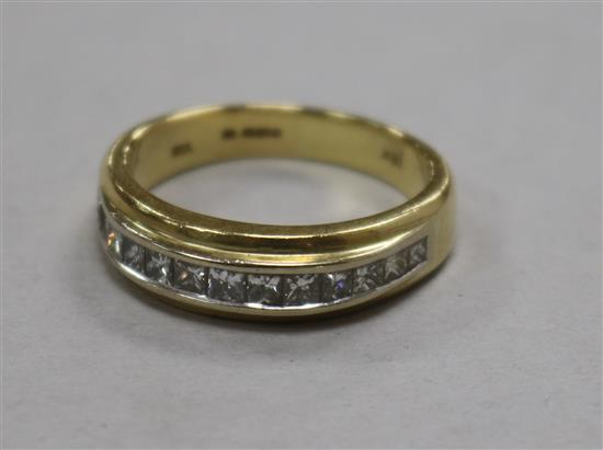 An 18ct white gold, sapphire and diamond dress ring, set with three pale blue cushion cut sapphires, size M.